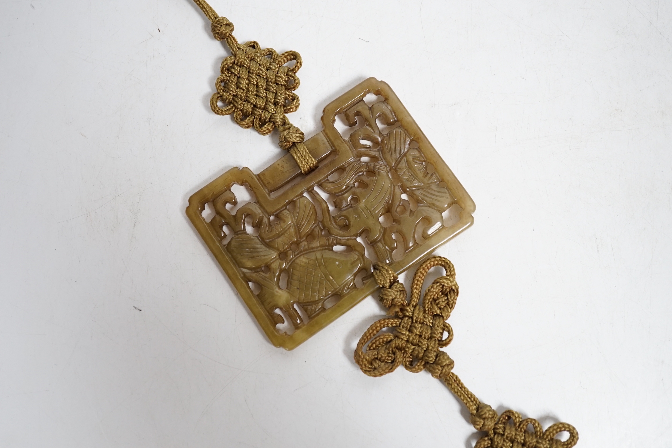 A Chinese carved jade ‘fish’ pendant, 6.5 x 9cm